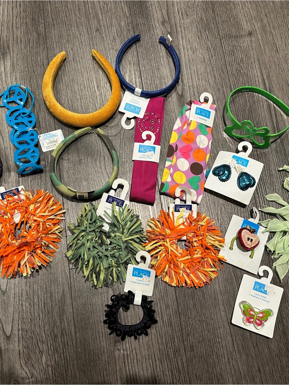 The Children's Place Orange Pom-Pom Hair Tie with Mixed Green and Black Accents